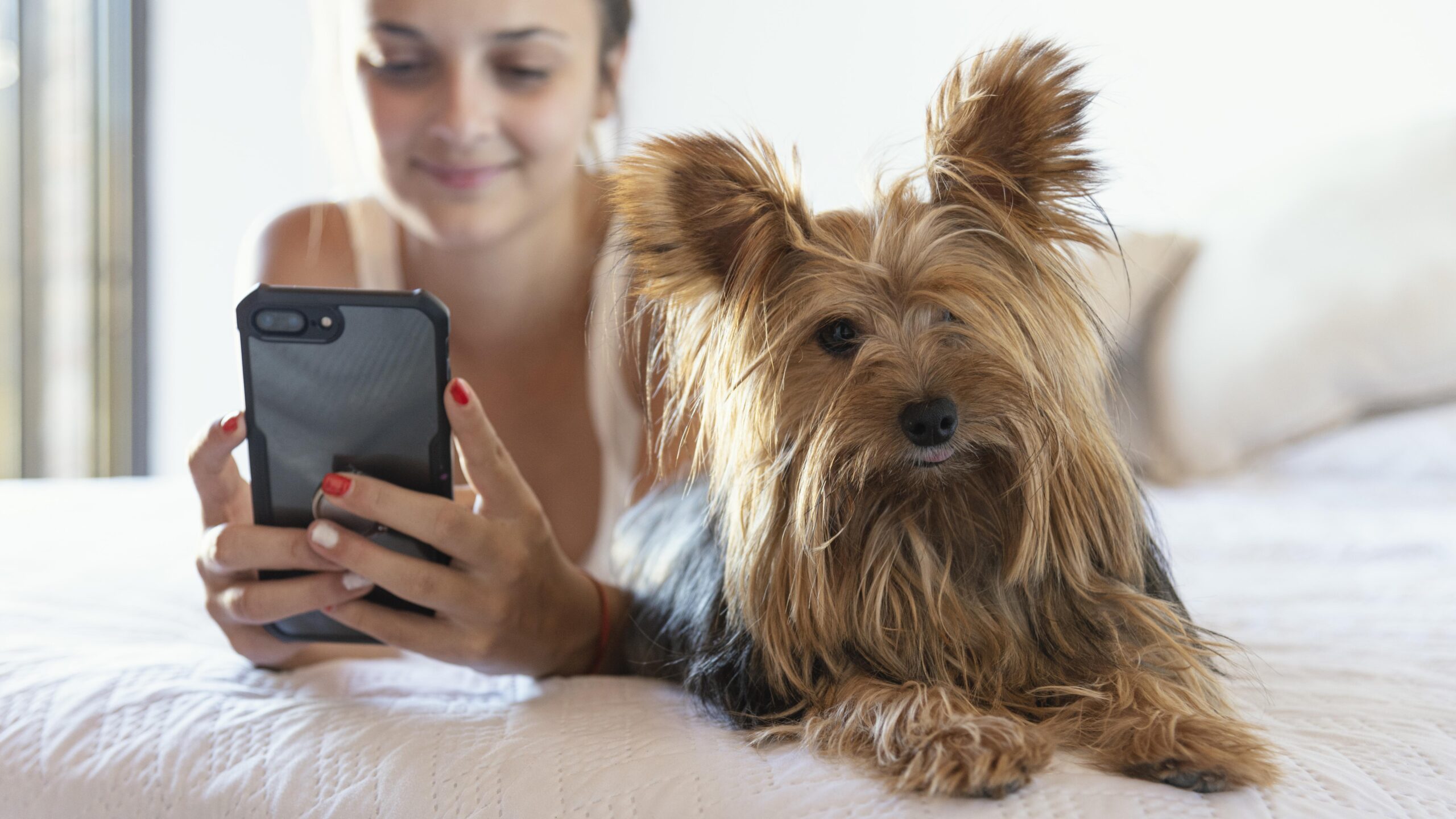 young-woman-with-dog-taking-selfie